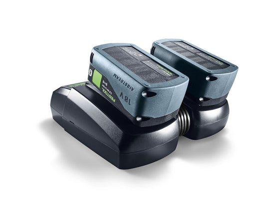 Festool TCL 6 DUO Schnellladegerät mit zwei Akkupacks in den Ladeschächten, LED-Anzeigen sichtbar.